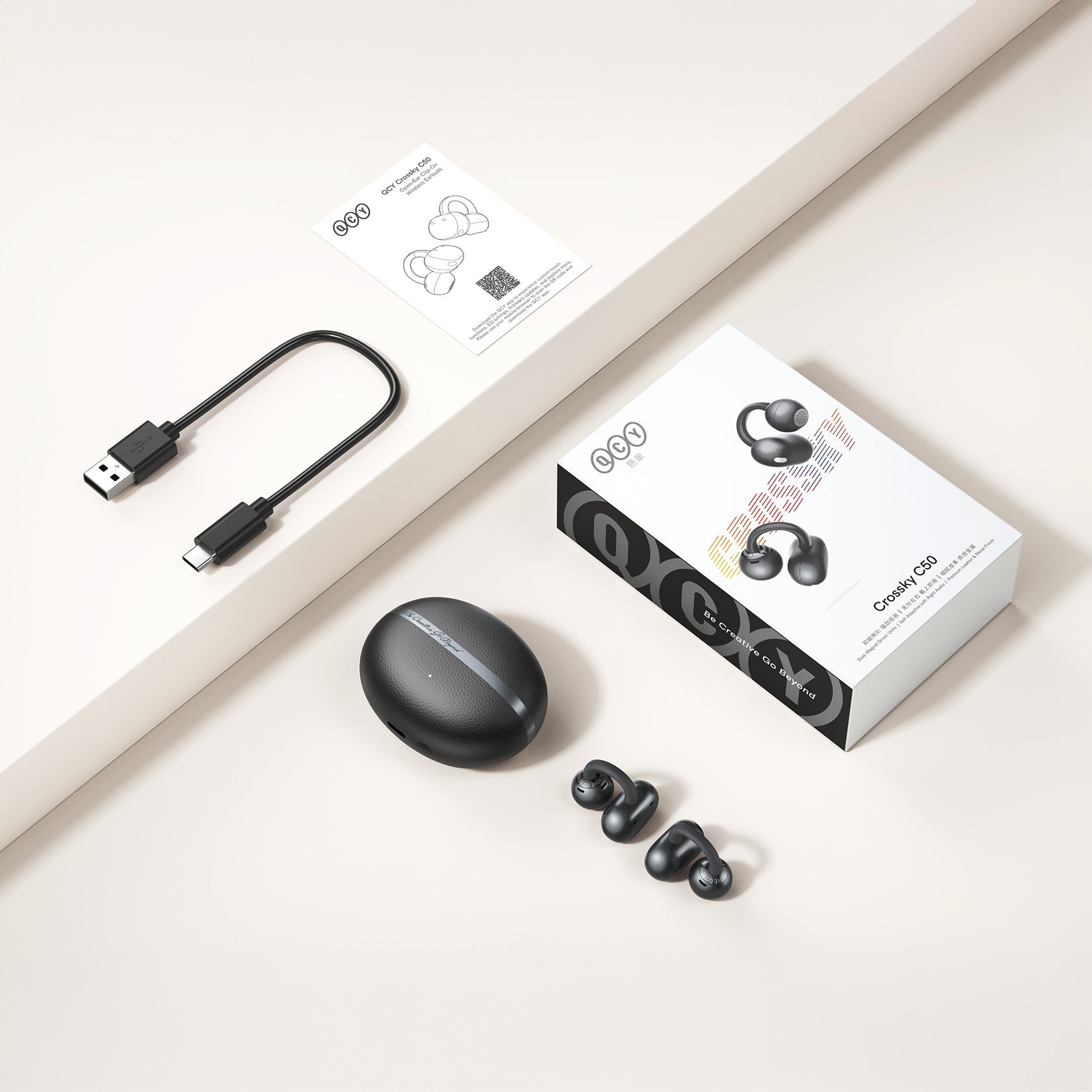 QCY Crossky C50 True Wireless Kopfhörer mit Ladebox, USB-C und Anleitung.