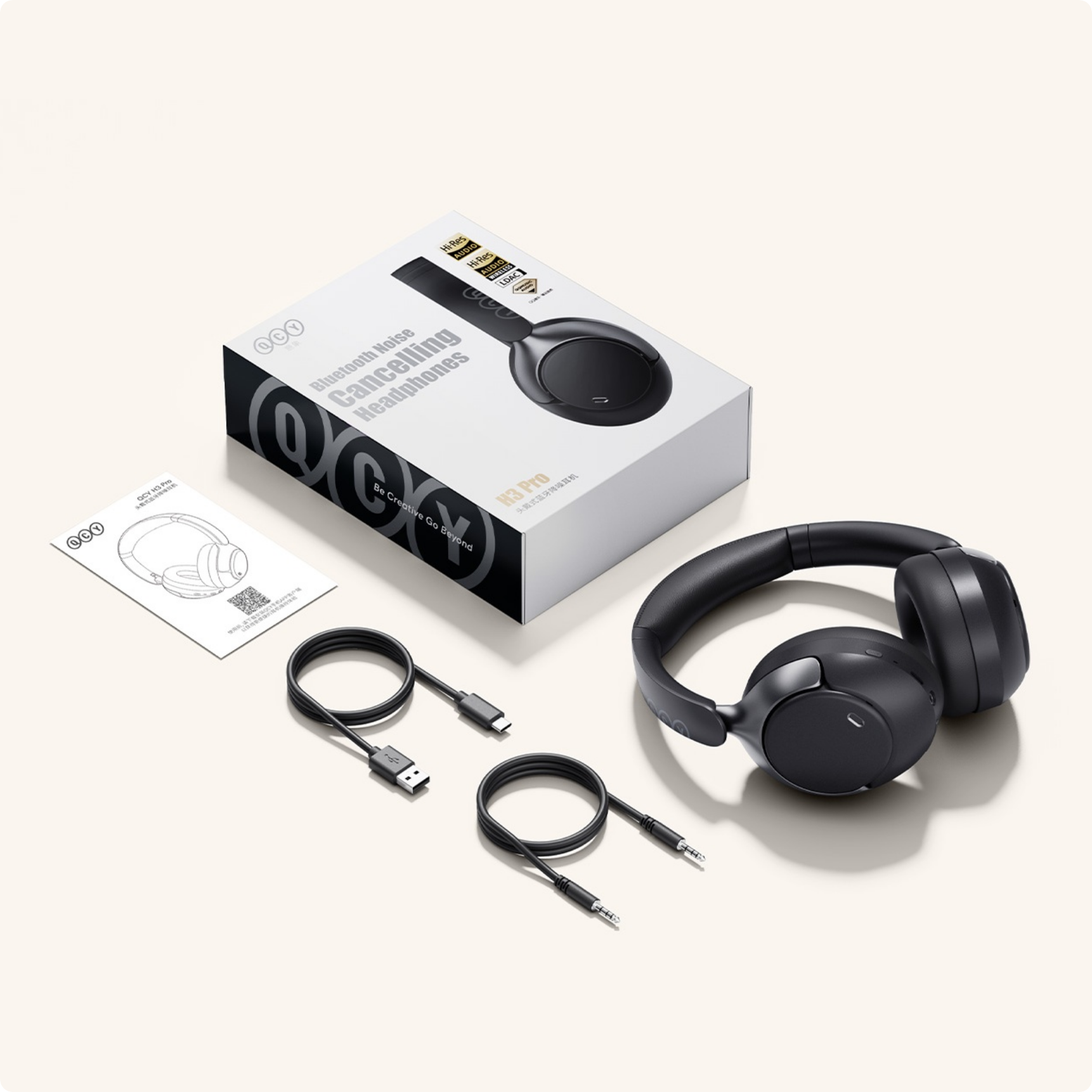 QCY H3 Pro Bluetooth Kopfhörer mit Noise Cancelling, Kabeln und Verpackung.